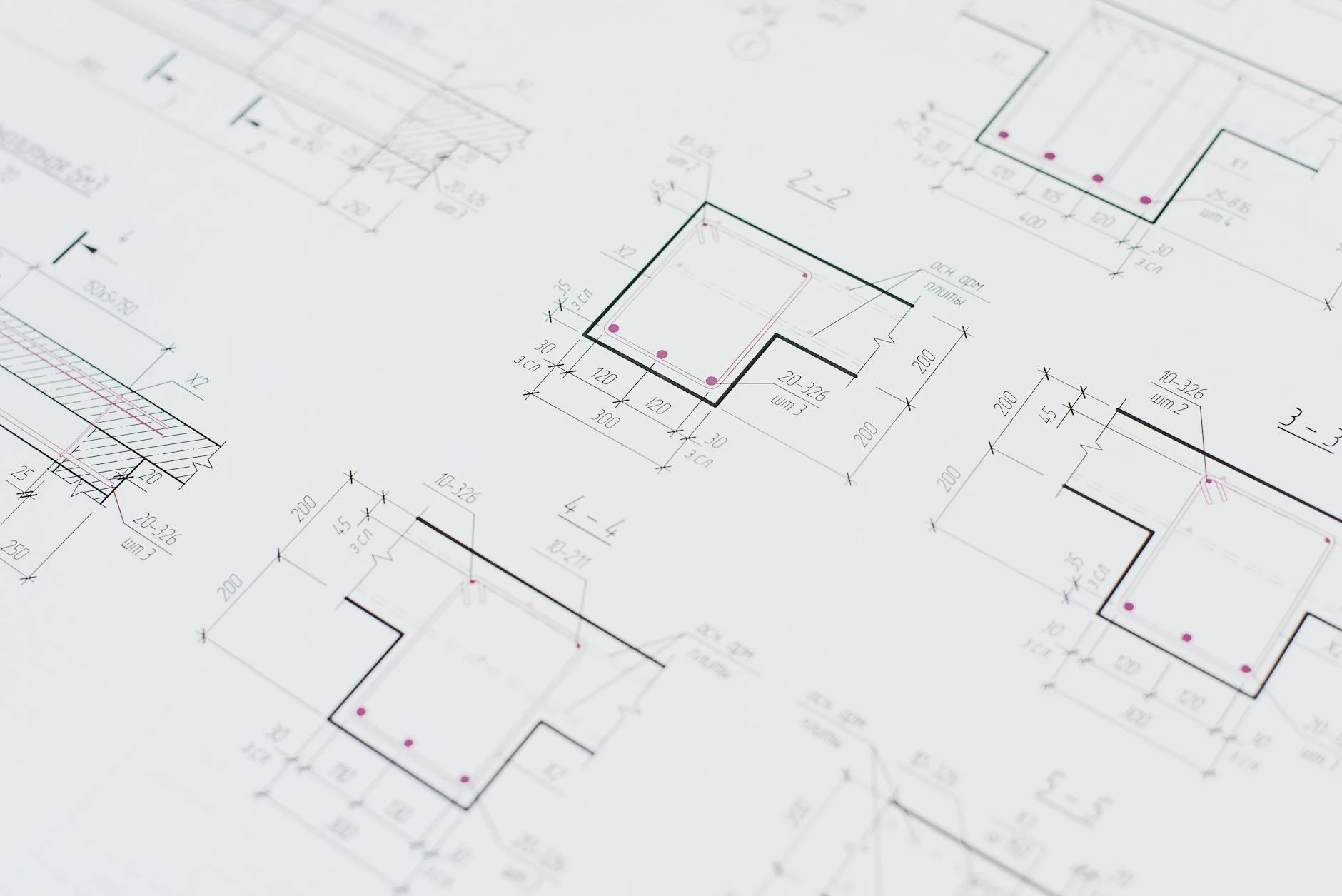 High-resolution close-up of detailed engineering blueprints showing precision design layouts